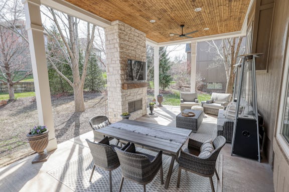 covered patio with fireplace and tv.jpg